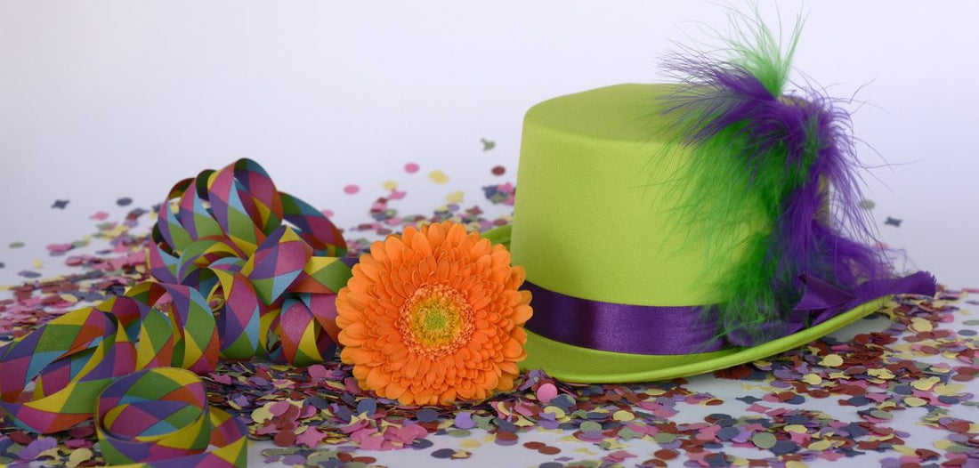 Image of green hat, confetti and orange flower.