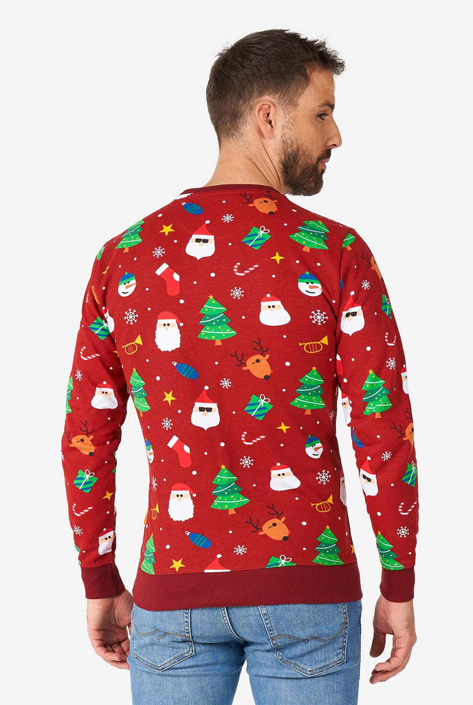 Mann, der einen roten Weihnachtspullover mit Weihnachtselikonen trägt, Blick von hinten
