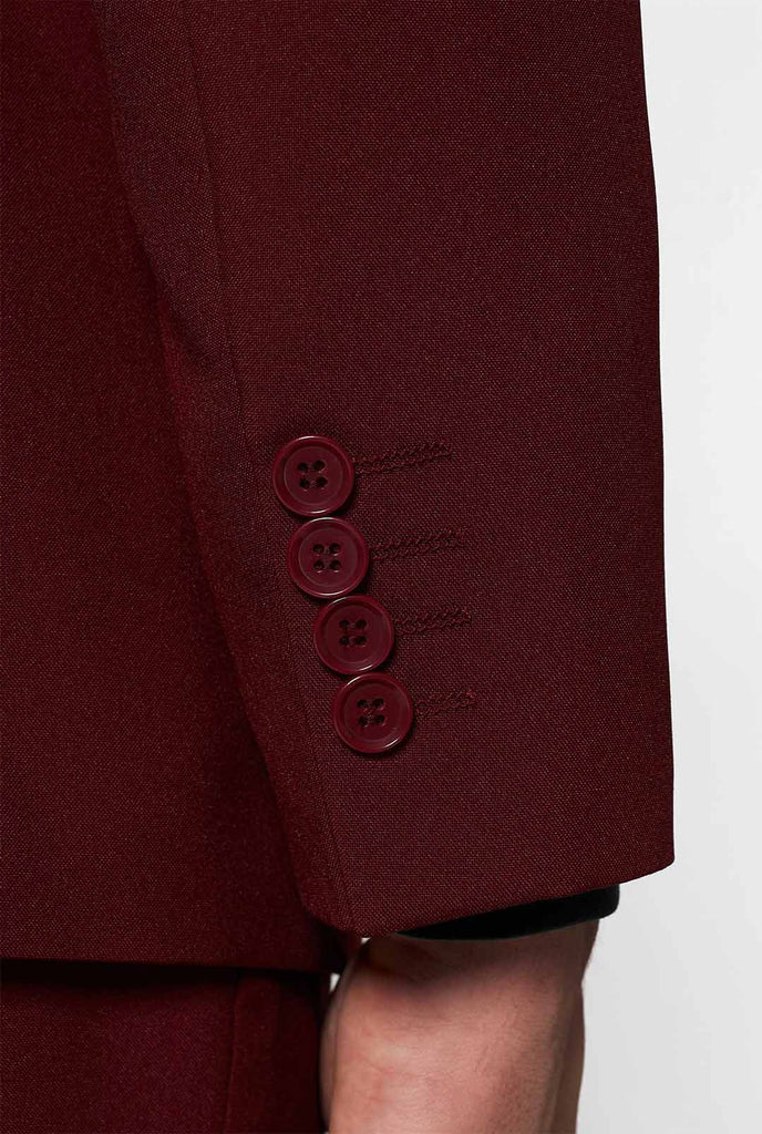 Bordeaux rot Festkörperanzug loderner Burgunder, getragen von Männern detaillierte Ärmel mit Knöpfen