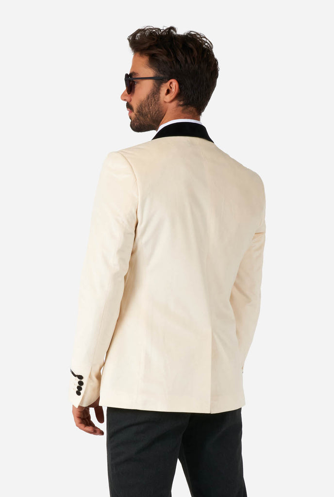 Man wearing ivory white velvet dinner jacket, view from the back