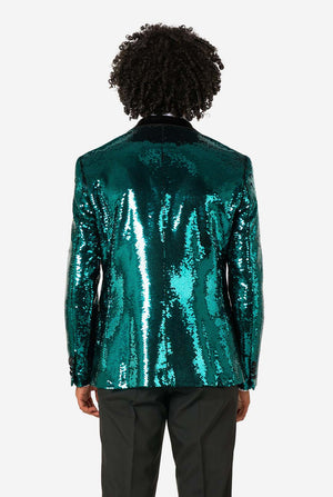 Ein Mann trägt einen türkis-glitzernden Blazer mit schwarzem Satin-Kragen.