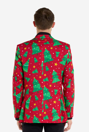 Mann trägt einen roten Weihnachtsblazer für Herren mit Weihnachtsbäumen und Sternen. Er trägt außerdem eine schwarze Hose und ein schwarzes Herrenhemd. Ansicht von hinten.