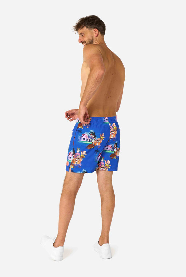 Blaue Badeshorts für Herren mit Dragon Ball-Motiv mit Goku, Krillin, Master Roshi und anderen Charakteren von Kame House. Perfekt für Anime-Fans am Strand oder Pool.