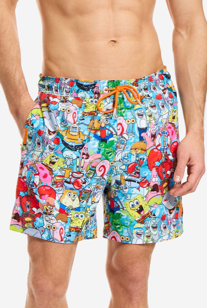 Man wearing swim trunks with SpongeBob print, close up