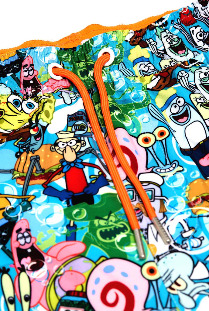 Man wearing swim trunks with SpongeBob print, close up