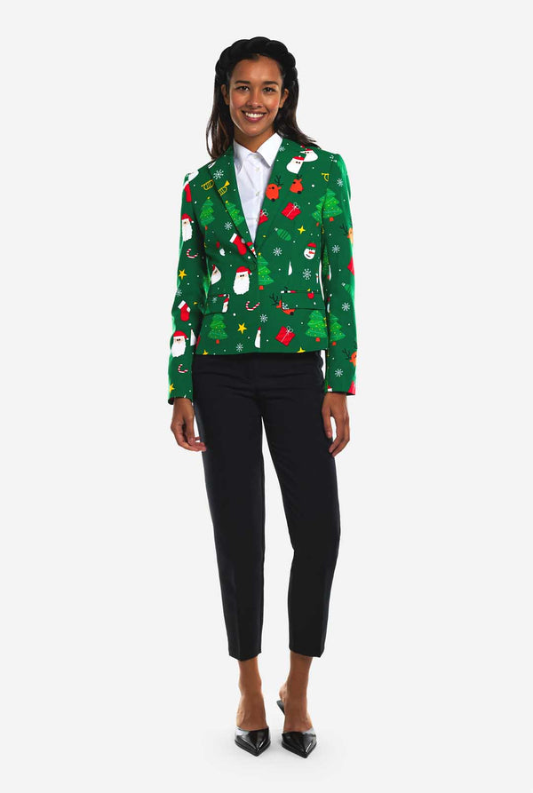 Frau trägt einen grünen Weihnachtsblazer für Damen, der mit Weihnachtsmotiven bedeckt ist.