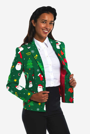 Frau trägt einen grünen Weihnachtsblazer für Damen, der mit Weihnachtsmotiven bedeckt ist.