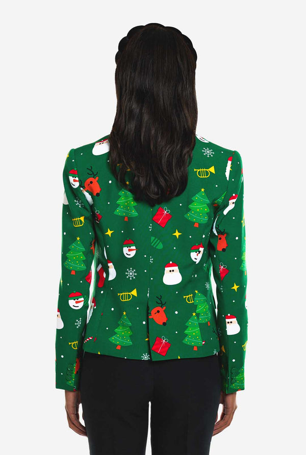 Frau trägt einen grünen Weihnachtsblazer für Damen, der mit Weihnachtsmotiven bedeckt ist.