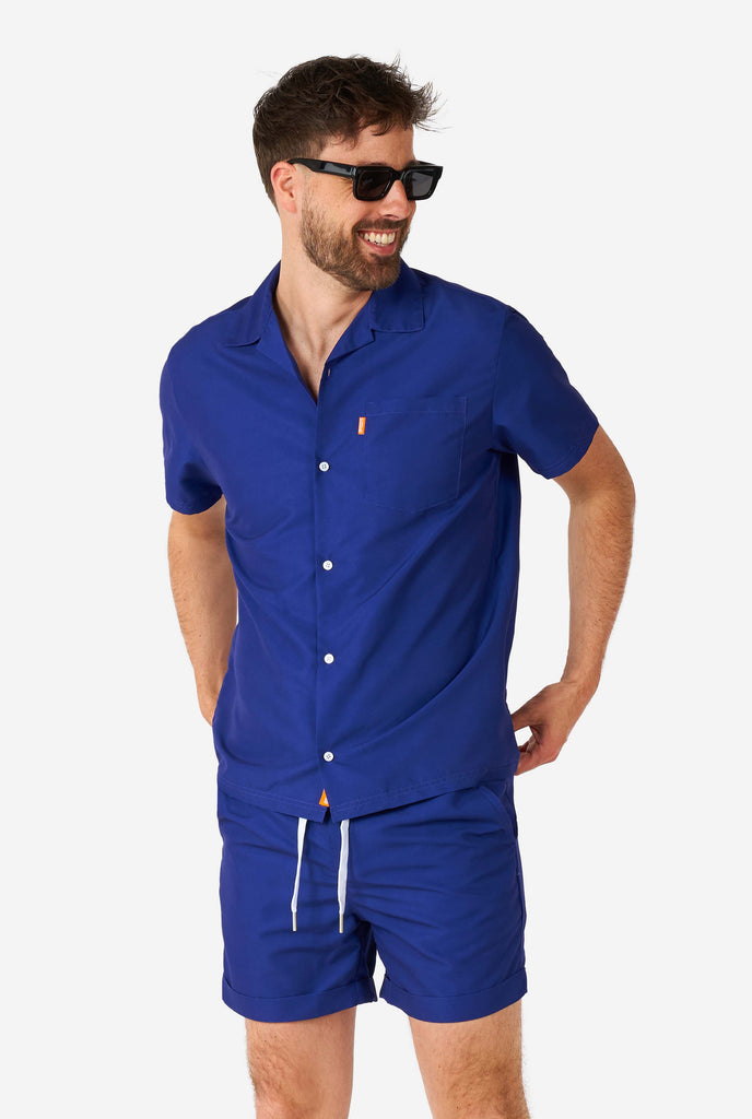 Men wearing blue summer set consisting of shirt and shorts