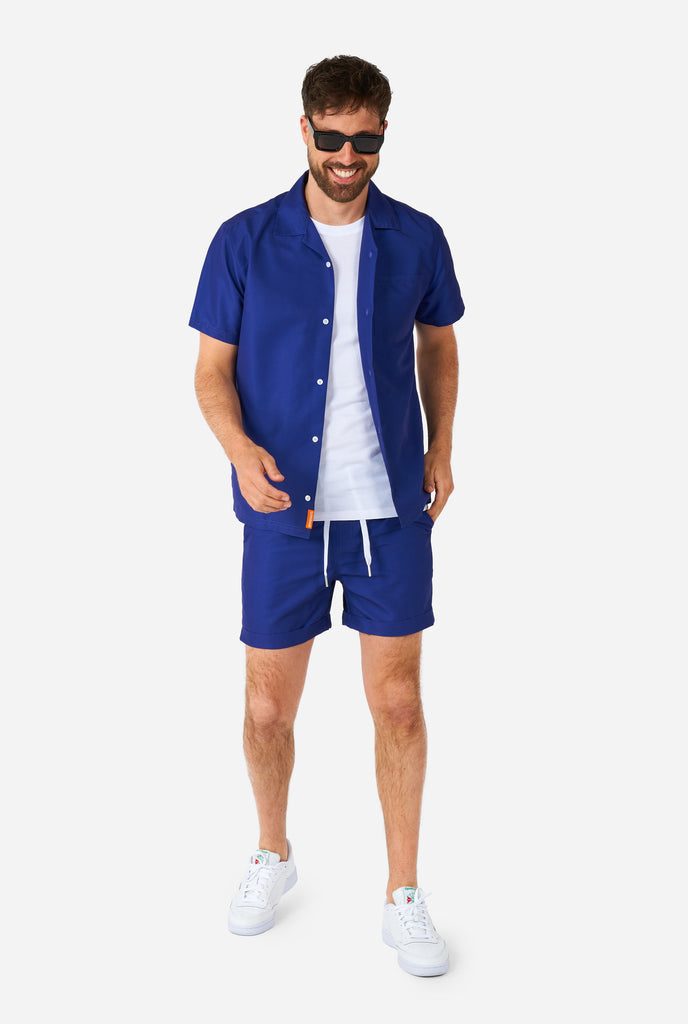 Men wearing blue summer set consisting of shirt and shorts