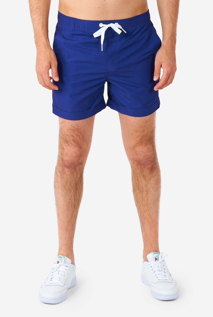 Men wearing blue summer set consisting of shirt and shorts