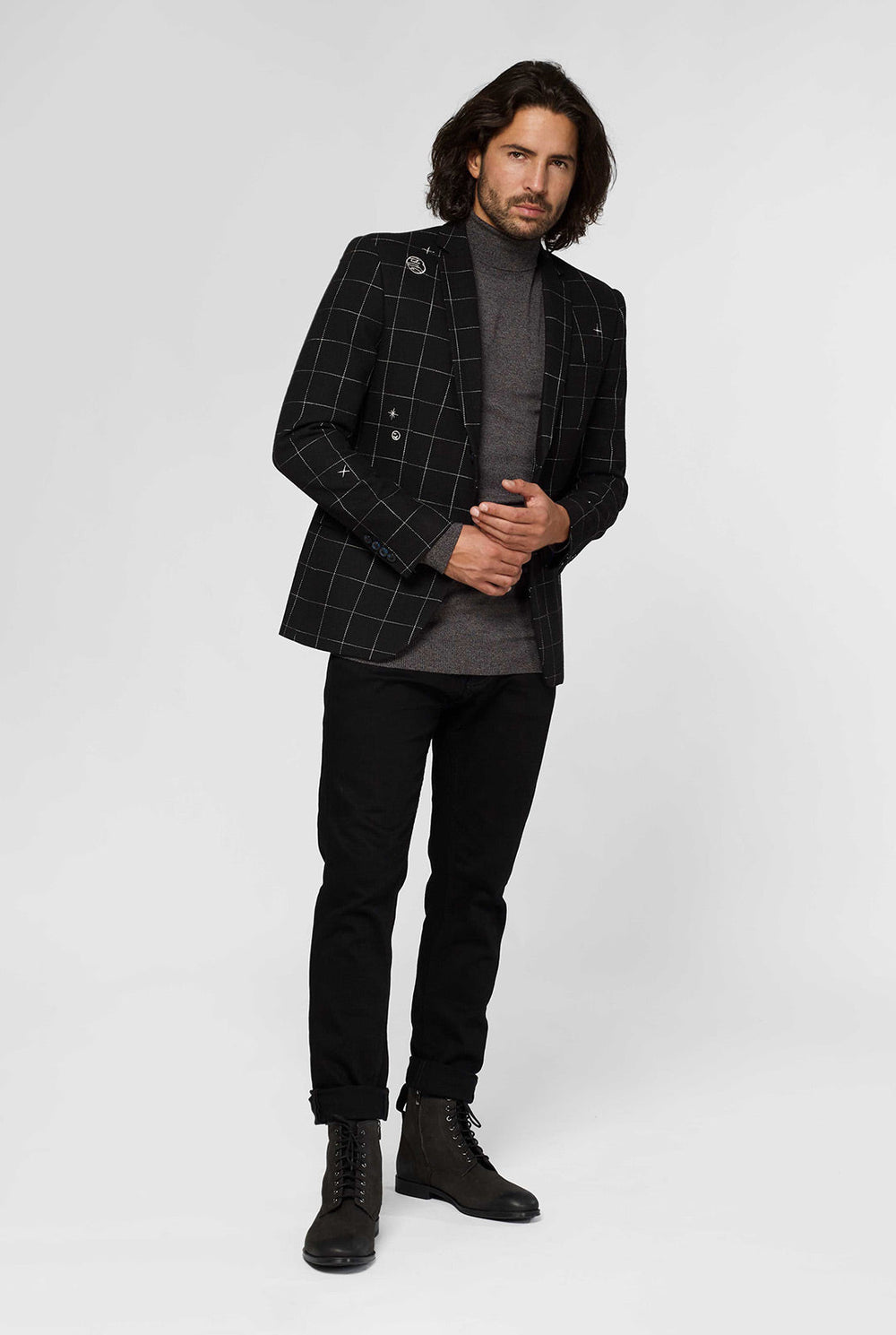 Schwarze Casual Blazer mit weißem Netzmuster, das vom Mann getragen wird