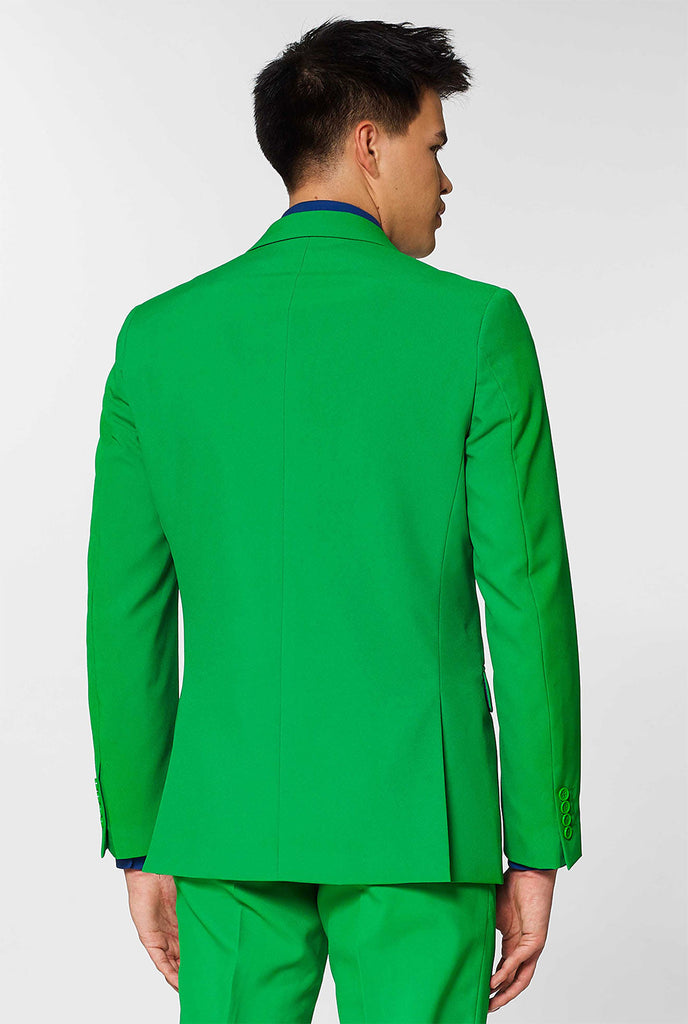Mann, der grünen Herrenanzug und dunkelblaues Hemd trägt, Blick von hinten