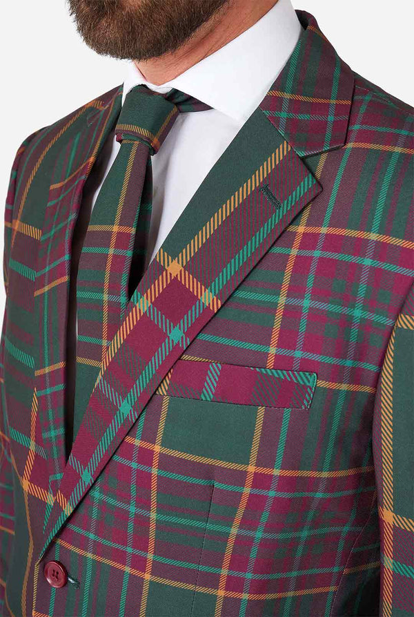 Mann, der einen Tartanplaid -Weihnachtsanzug trägt, Nahaufnahme Jacke