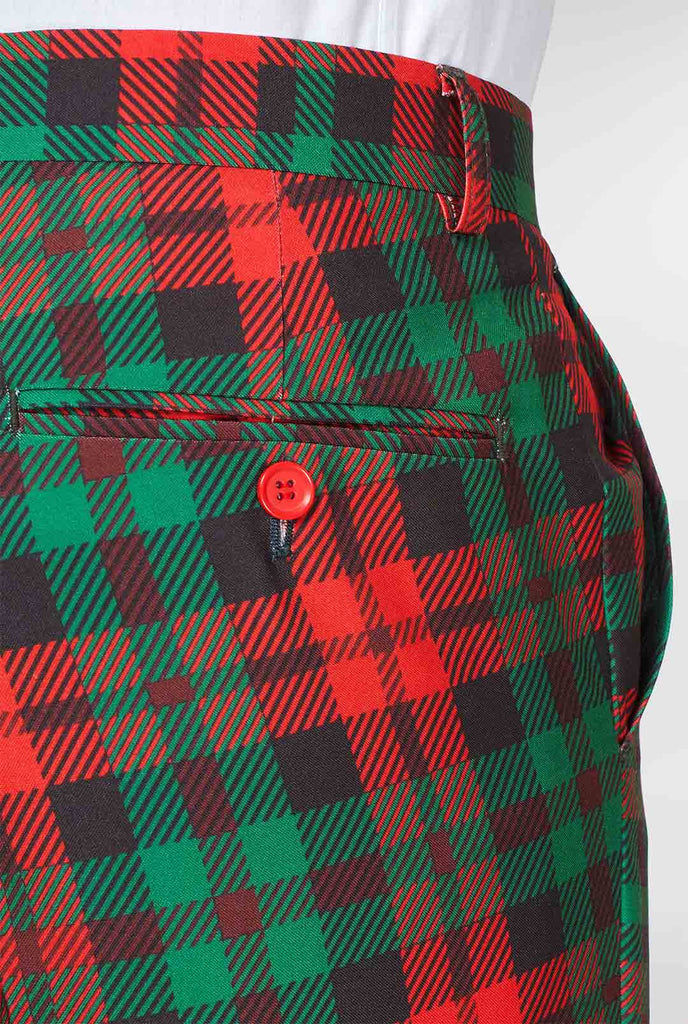 Rückseite der grünen und roten Tartan -Anzughose, die vom Mann getragen wird