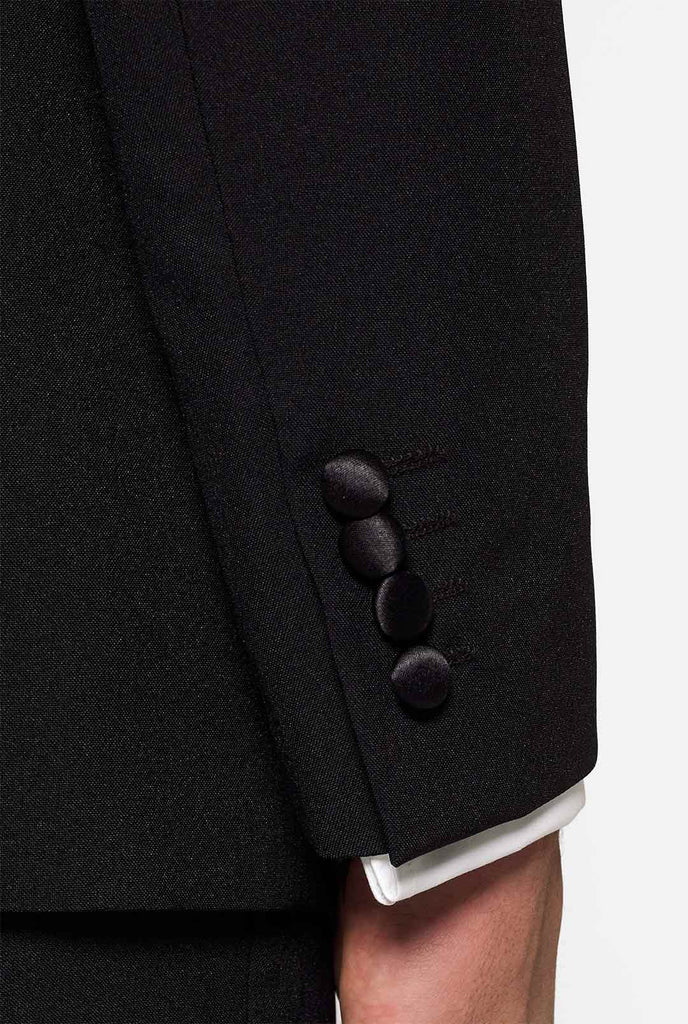 Solide schwarze Smokinganzug Jetset Schwarz, getragen von Mannhülsen mit schwarzen Knöpfen