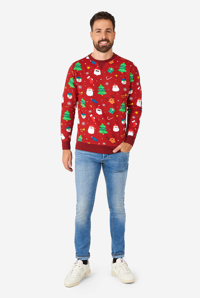 Mann, der roten Weihnachtspullover mit Weihnachtselikonen trägt