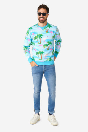 Mann, der blauen Pullover mit tropischem Flamingo -Druck trägt