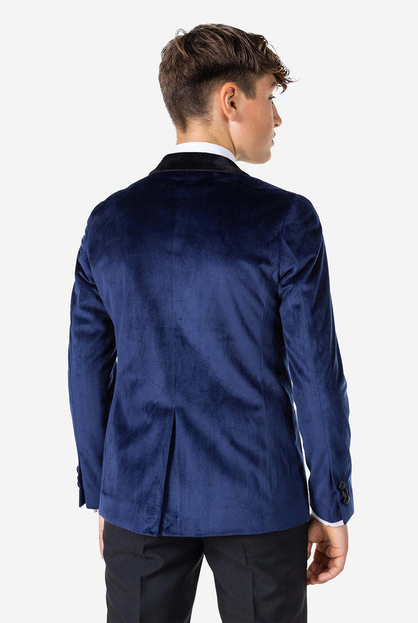Teenager, der Blaue Samt Weihnacht Jacke trägt, Blick von hinten