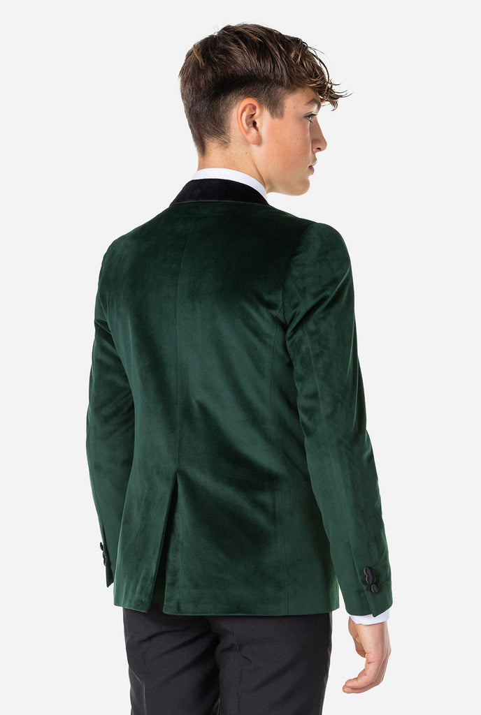 Teenager, der grüne Samt Weihnachts Jacke trägt, Blick von hinten
