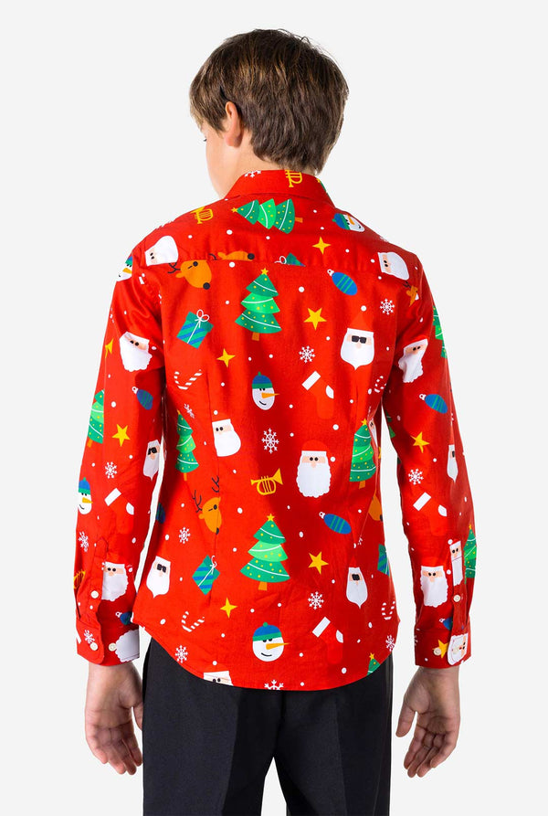 Teenager Jungen, das rotes Hemd mit Weihnachtsdruck trägt, Blick von hinten