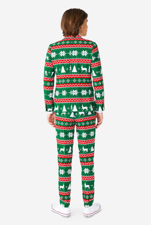 Teenager, der grünen formalen Weihnachtsanzug trägt, Blick von hinten