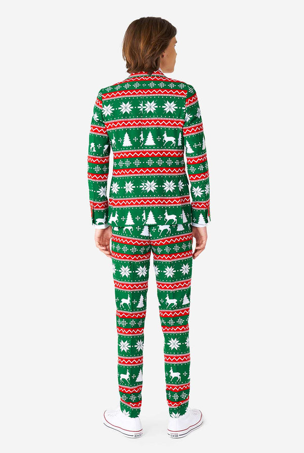 Teenager, der grünen formalen Weihnachtsanzug trägt, Blick von hinten
