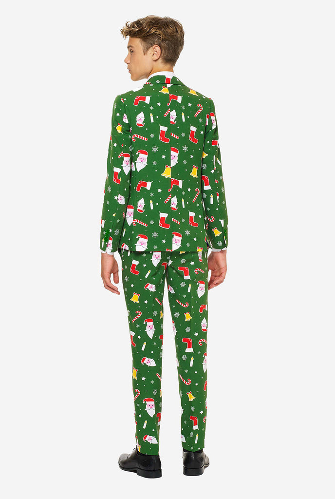 Teenager, der grünen Weihnachtsanzug trägt, Blick von hinten