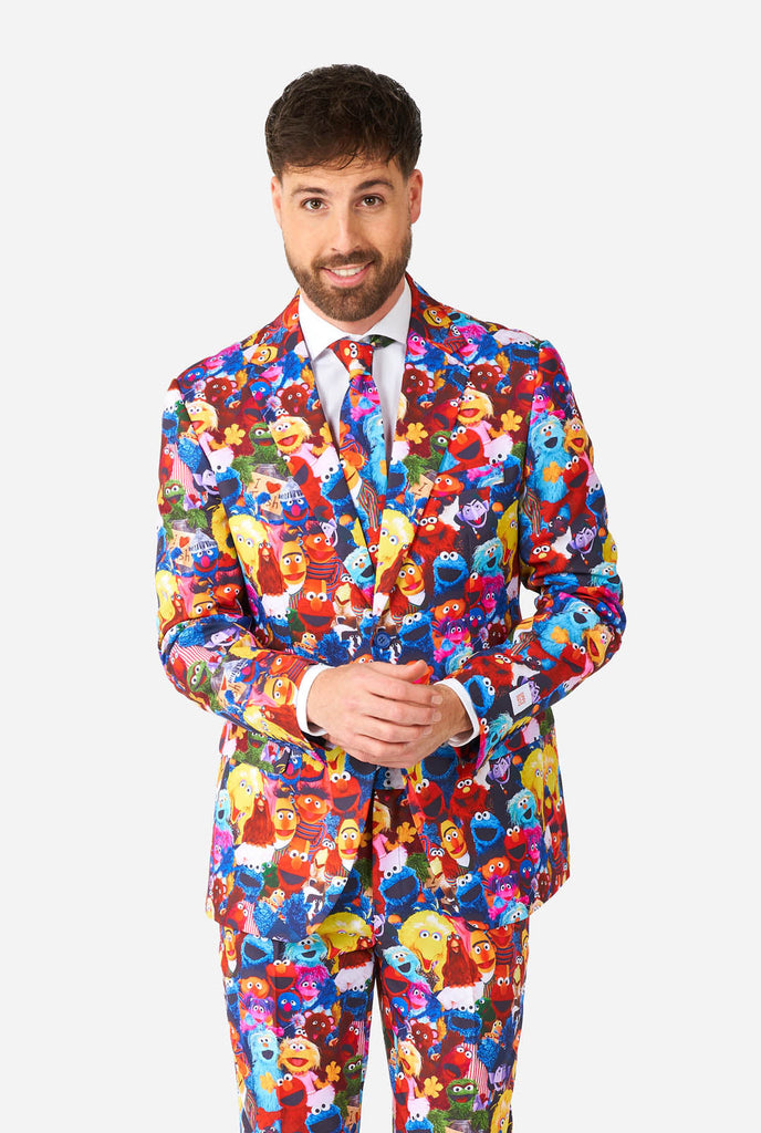 Man wearing men's suit with Sesame street characters print