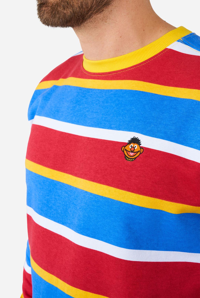 Man wearing Men's Sweater with iconic Sesame Street Ernie pattern with Yellow, red, blue and white stripes, close up