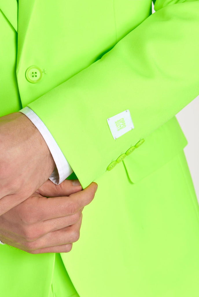 Man wearing neon lime green colored suit, sleeve close up